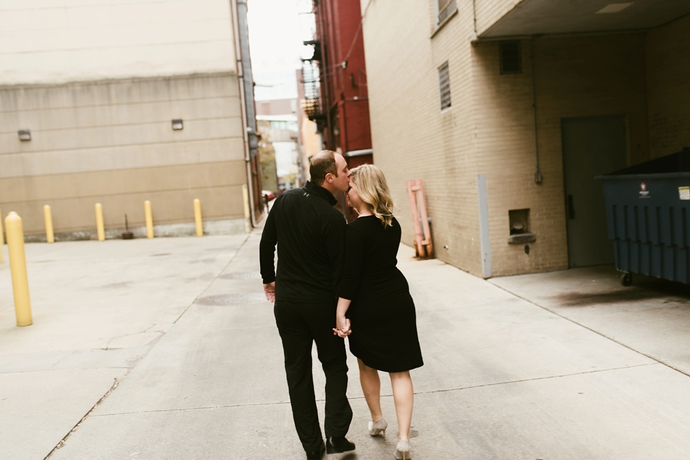 couple kissing at downtown fort wayne engagement session
