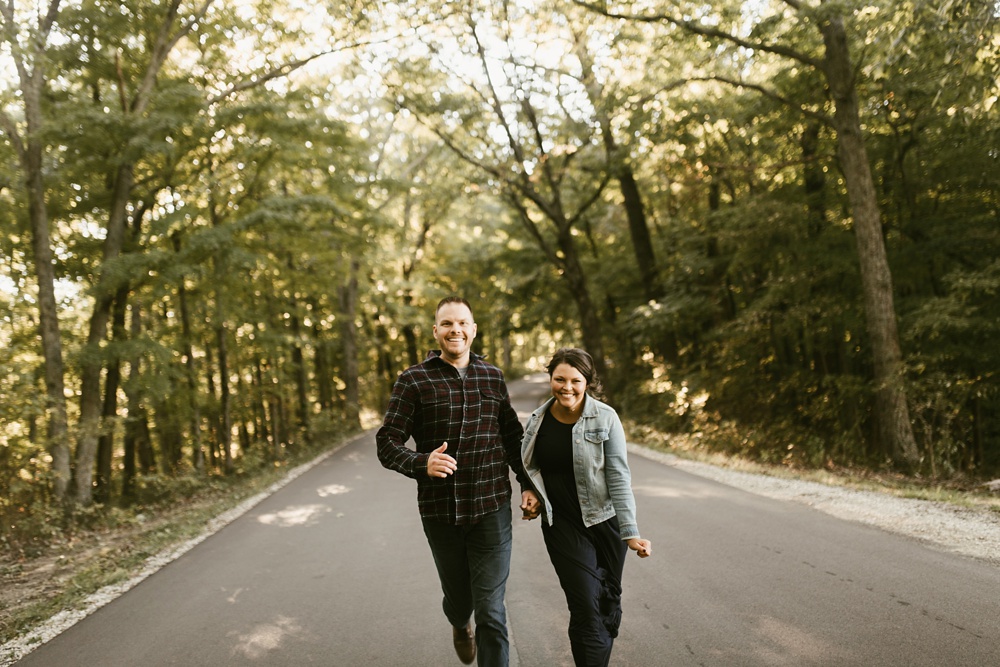 couple running at brown county engagement session