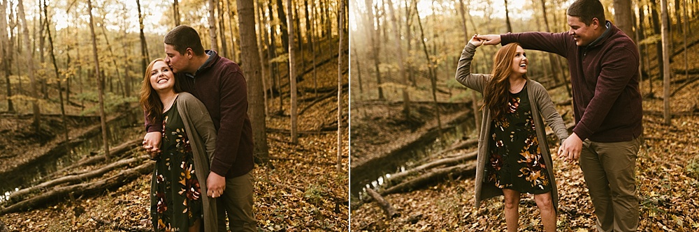 couple dancing in woods at chain o'lakes fall engagement session