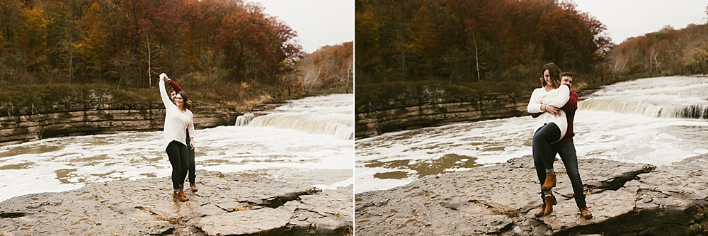 couple hugging next to falls at cataract falls fall engagement session