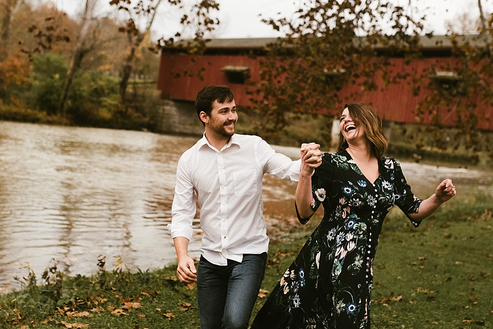 couple dancing at cataract falls fall engagement session