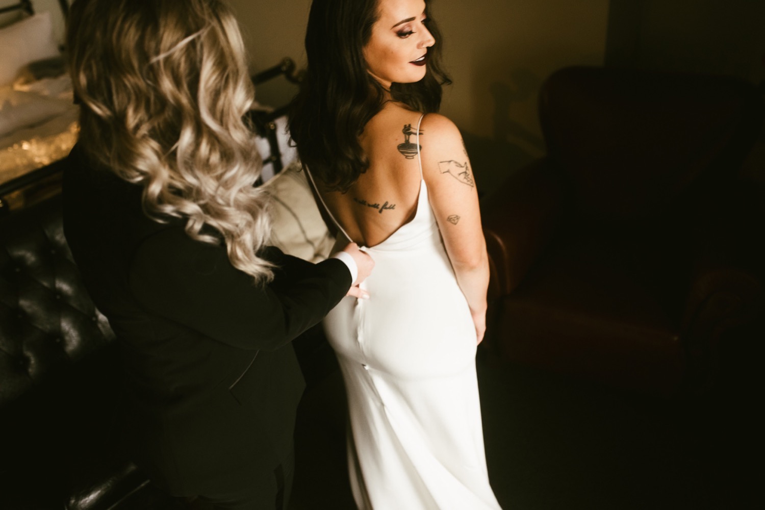 Chicago bride putting her chic gown on.