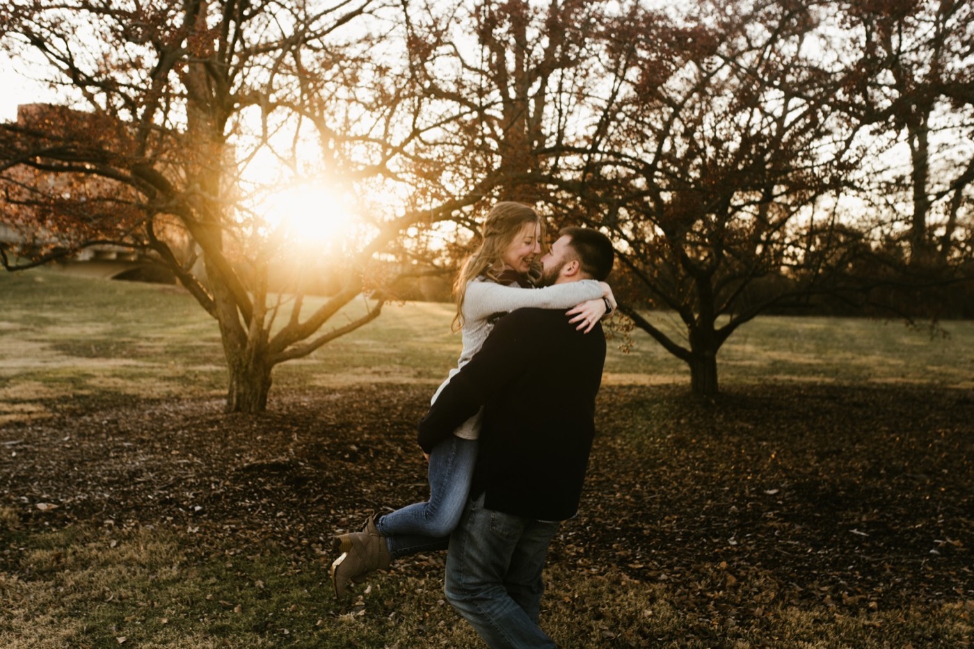 couple hugging at golden hour at downtown fort wayne engagement session