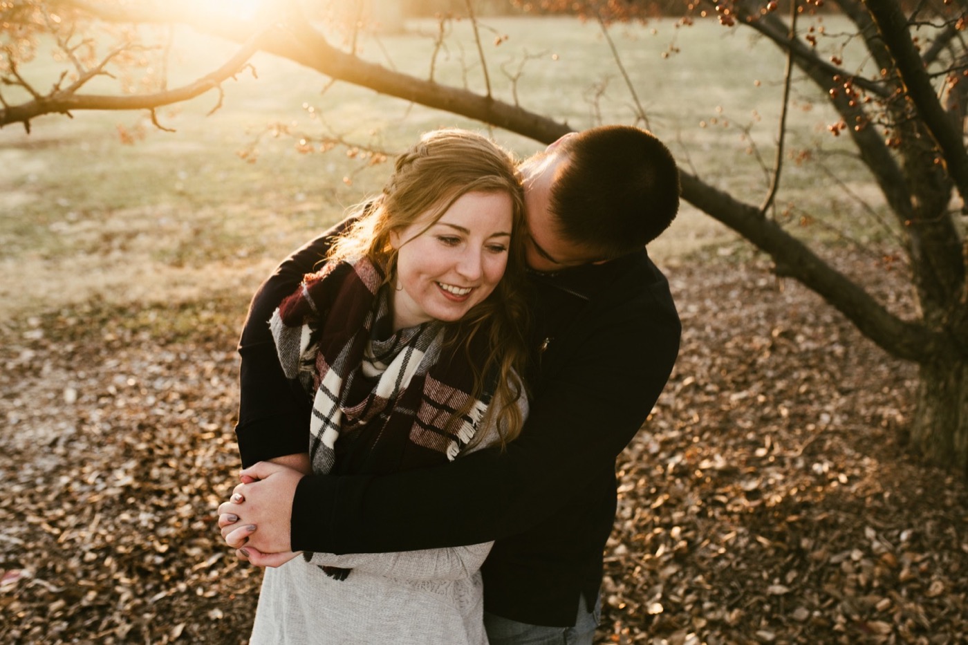 couple hugging at downtown fort wayne engagement session
