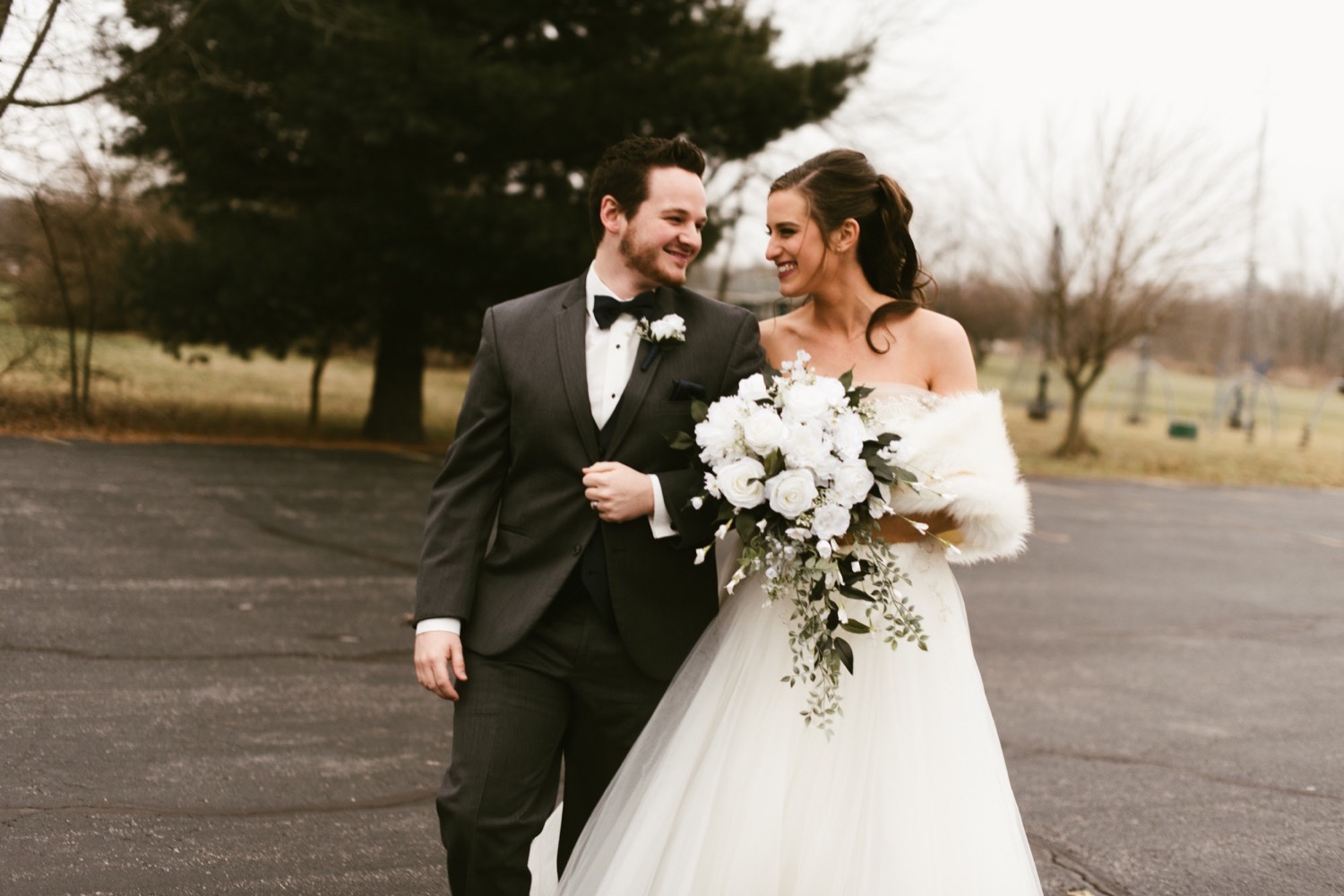 groom and bride with malinda strattong bouquet at fort wayne winter wedding