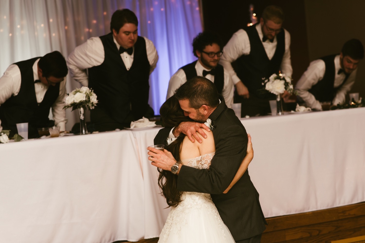 father and bride hugging at fort wayne winter wedding