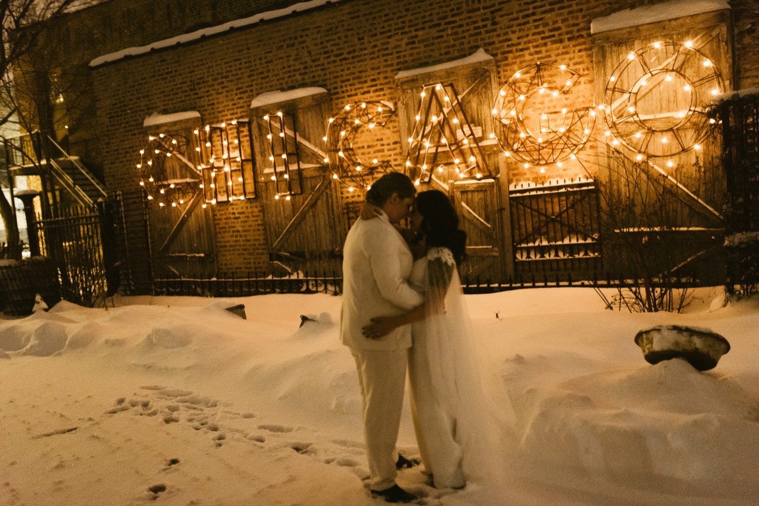 Chicago wedding reception snowy night - couple dancing and hugging.
