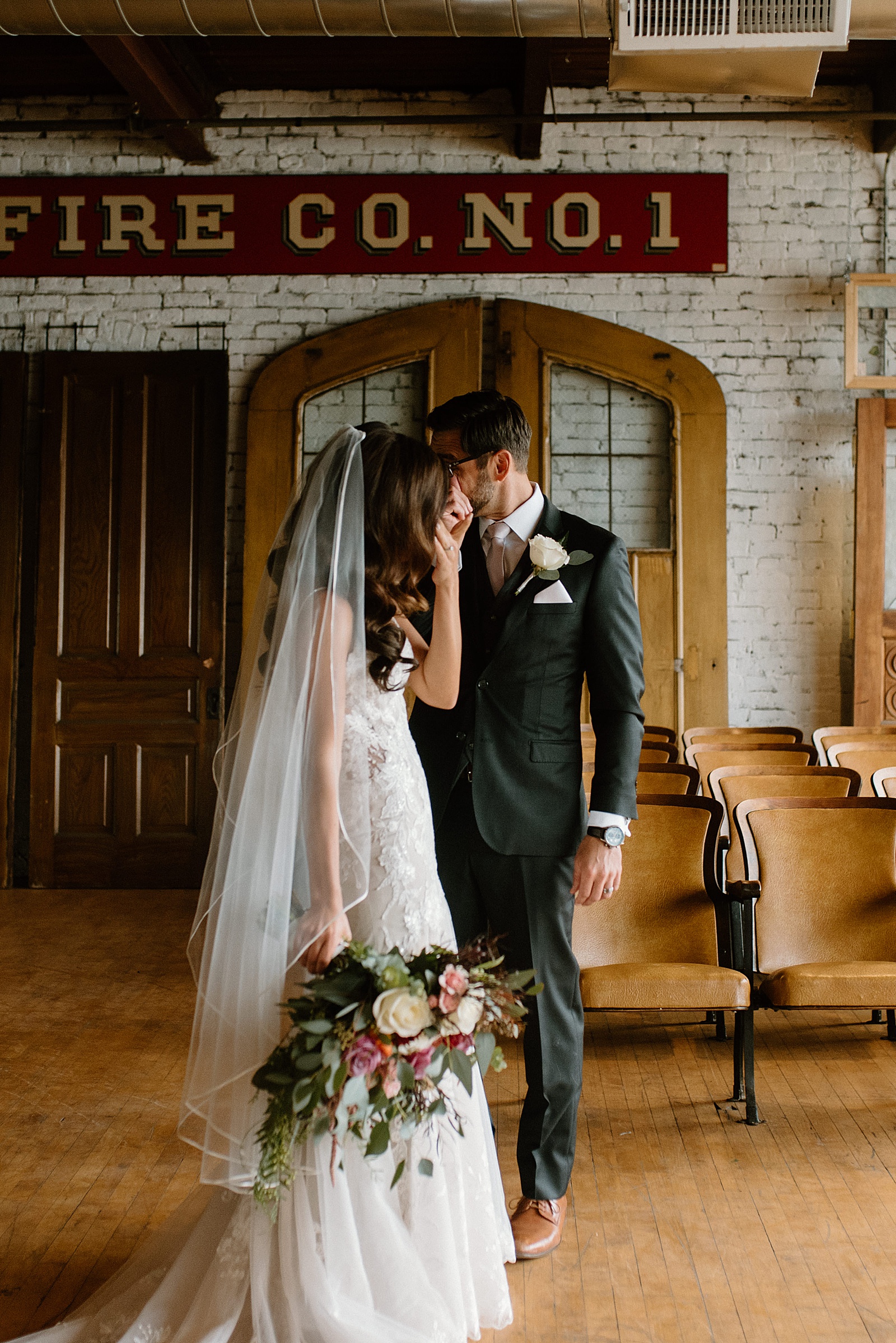 Bride and groom wipe away tears after their first look by Chicago wedding photographer, Indigo Lace 