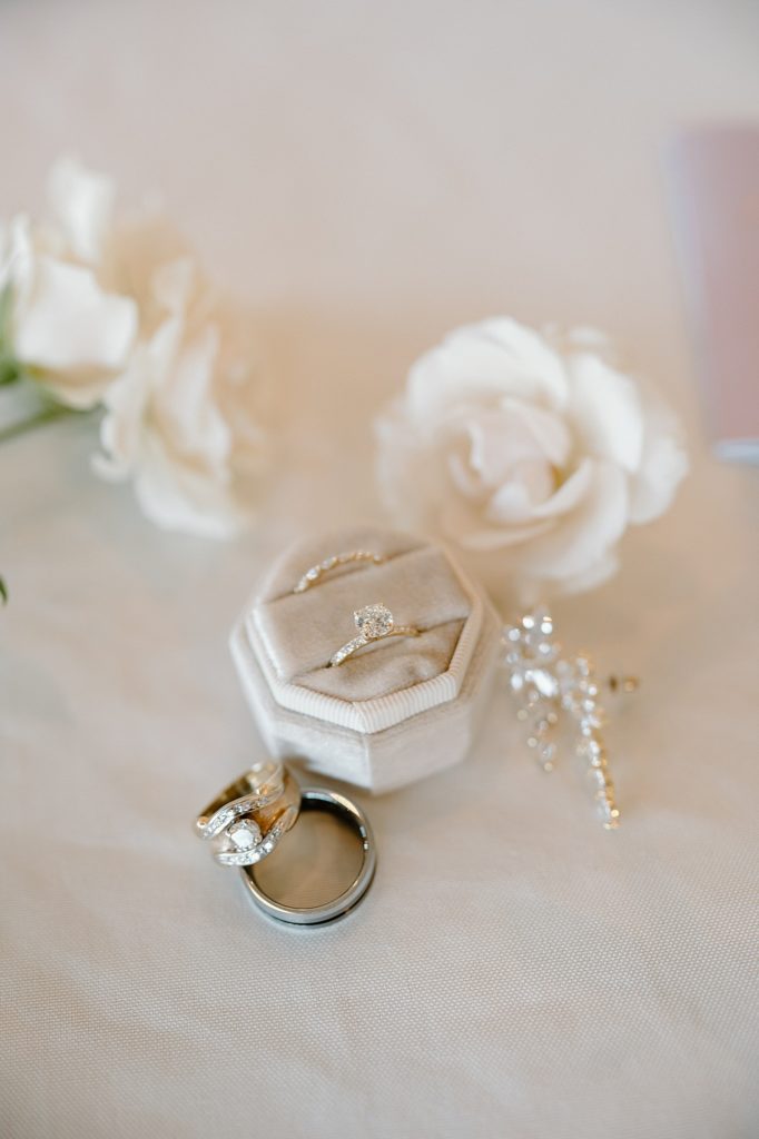 Wedding rings in a velvet box surrounded by flowers by Fort Wayne photographer, Indigo Lace.