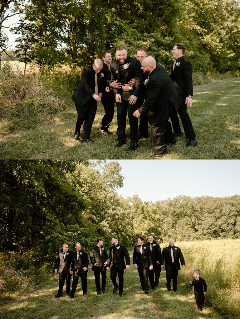 Groomsmen tackling groom in a field for this Fort Wayne wedding. 