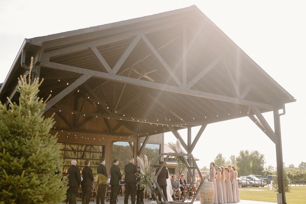 A ceremony in the evening sunlight at Union 12 wedding venue in Indiana. 