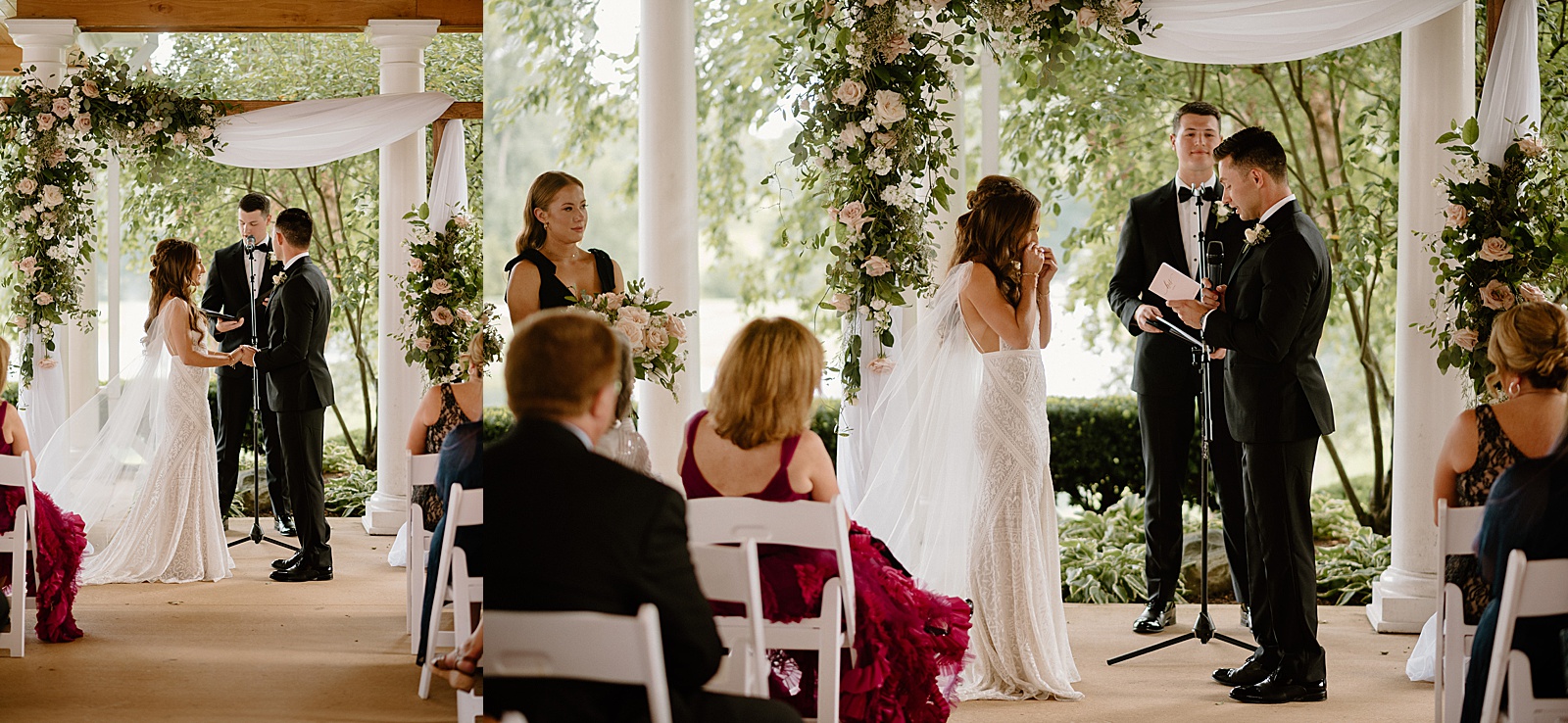 Bride wiping away a tear during her wedding ceremony under a floral arch. 