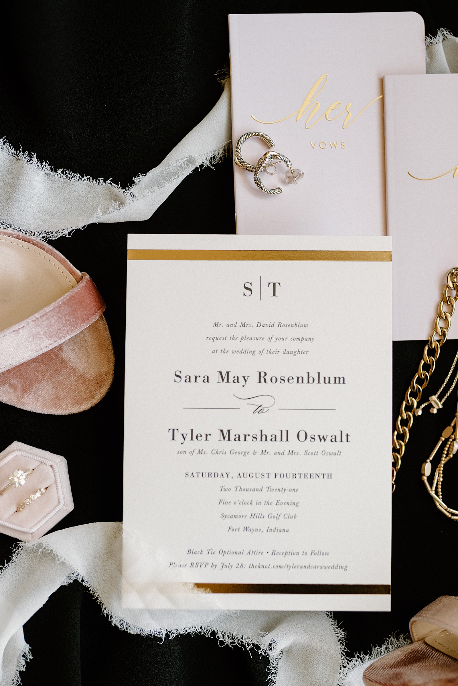 A wedding invitation for Sara & Tyler who had a Sycamore Hills Summer Wedding.