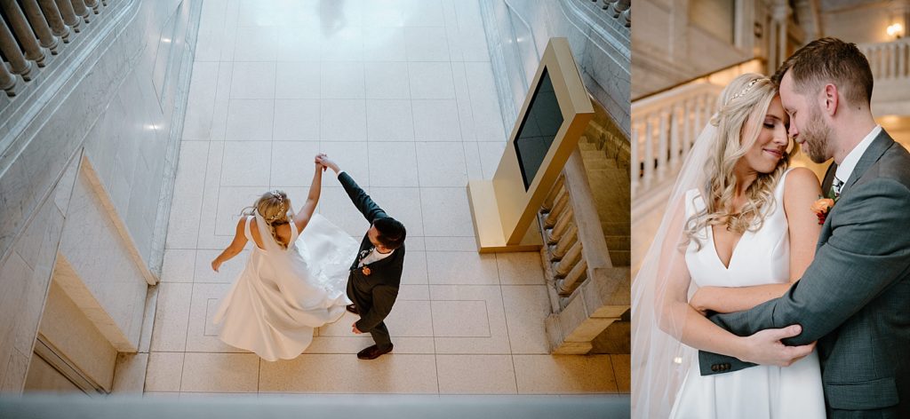Groom twirling bride in a lobby for their boho wedding 
