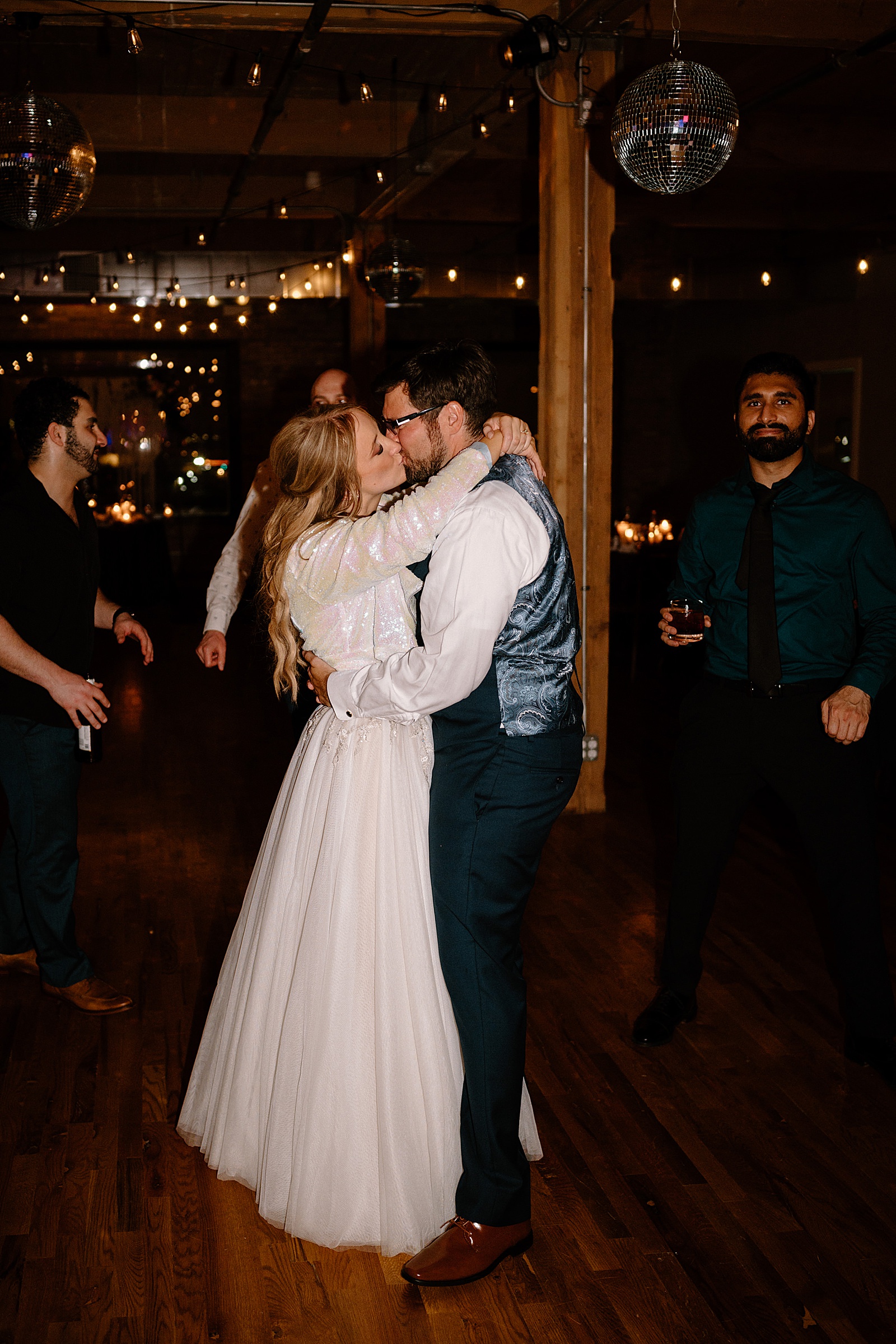 bride and groom kissing on the dance floor at Lacuna Lofts