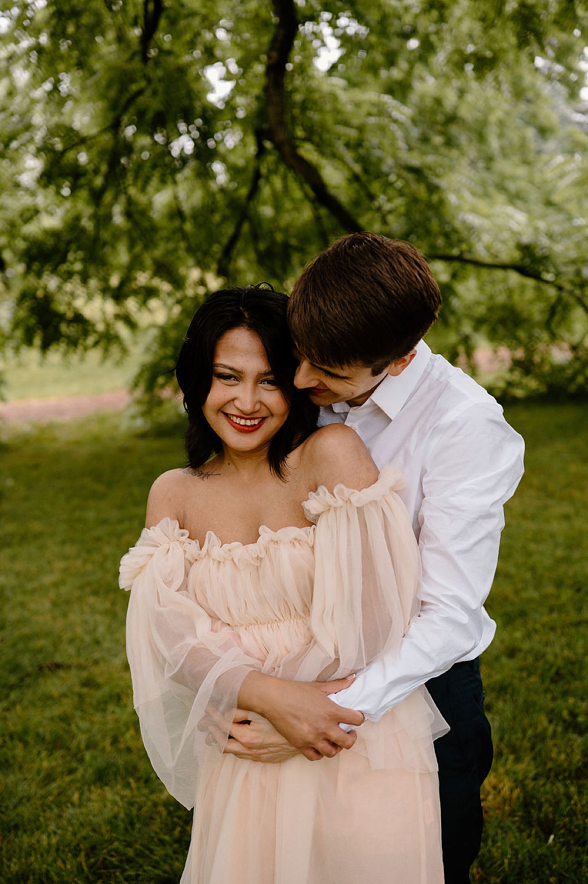 couple pose during outdoor romantic engagement shoot by midwest wedding photographer