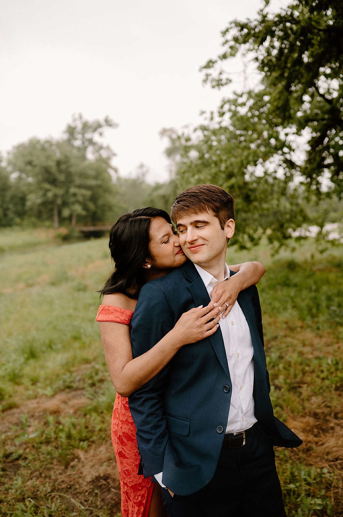 man and woman pose for elegant outdoor engagement shoot with midwest wedding photographer