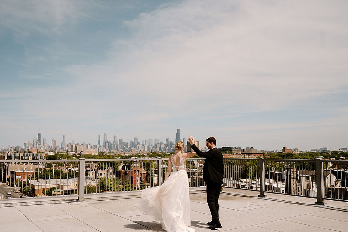 bride and groom dance on Chicago rooftop before Sami and Andrew's Whimsical Summer Wedding