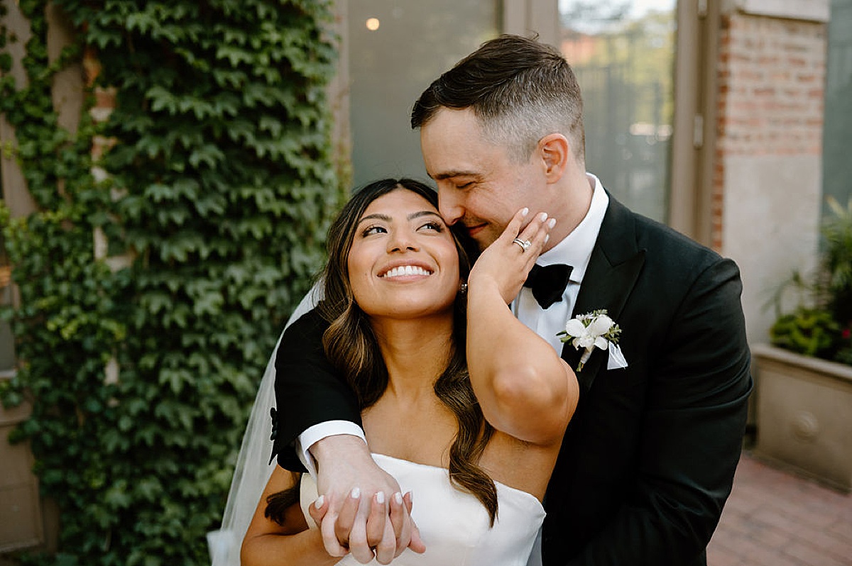 classy newlywed bride and groom embrace after Mae District intimate Chicago Wedding