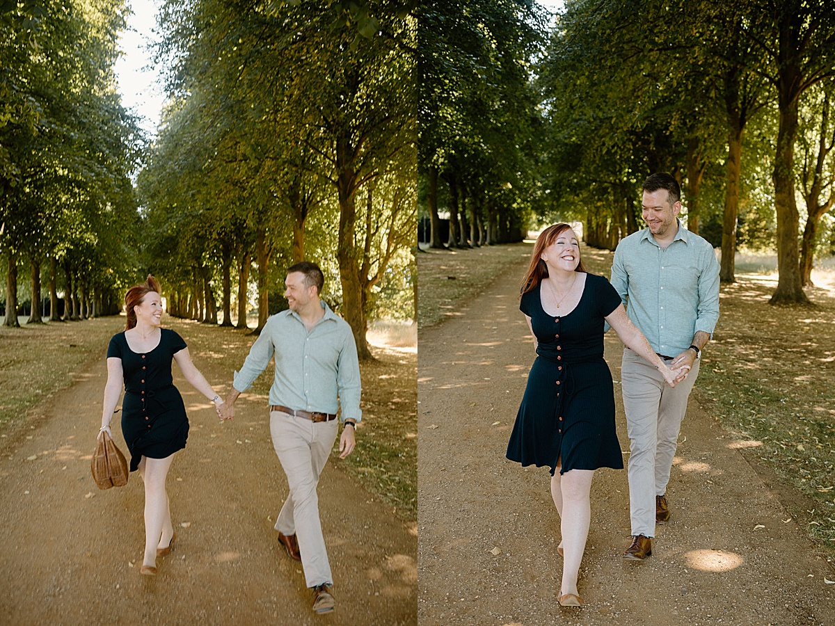couple walks hand in hand through garden path during engagement shoot with Indigo Lace Collective
