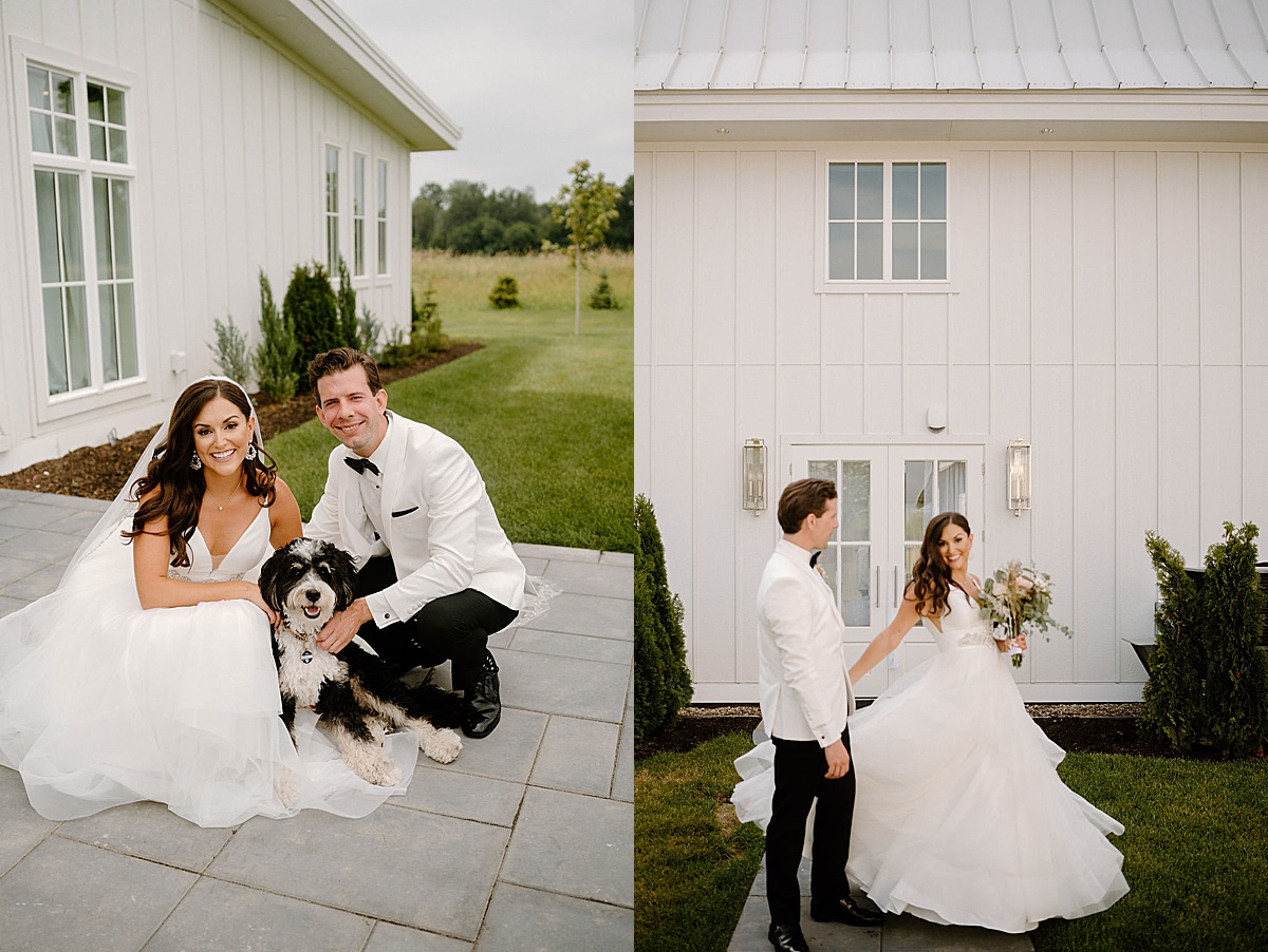 bride in tulle gown and elegant groom in white jacket pose with bernedoodle puppy before romantic Etre Farms summer wedding