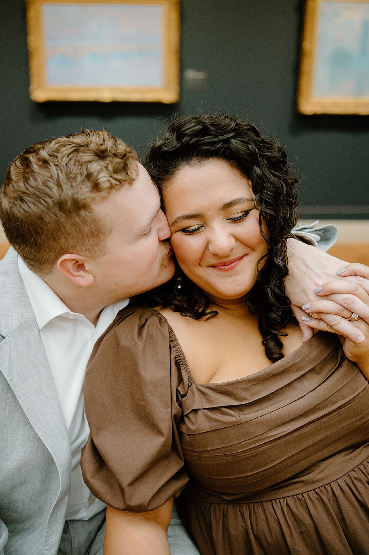 cute couple kiss during romantic engagement session by Indigo Lace Collective at Chicago Art Institute