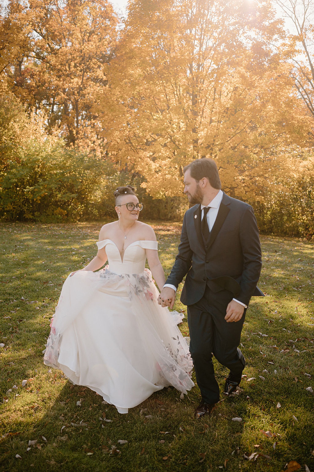 cute artsy couple pose for midwest wedding photographer after autumn ceremony