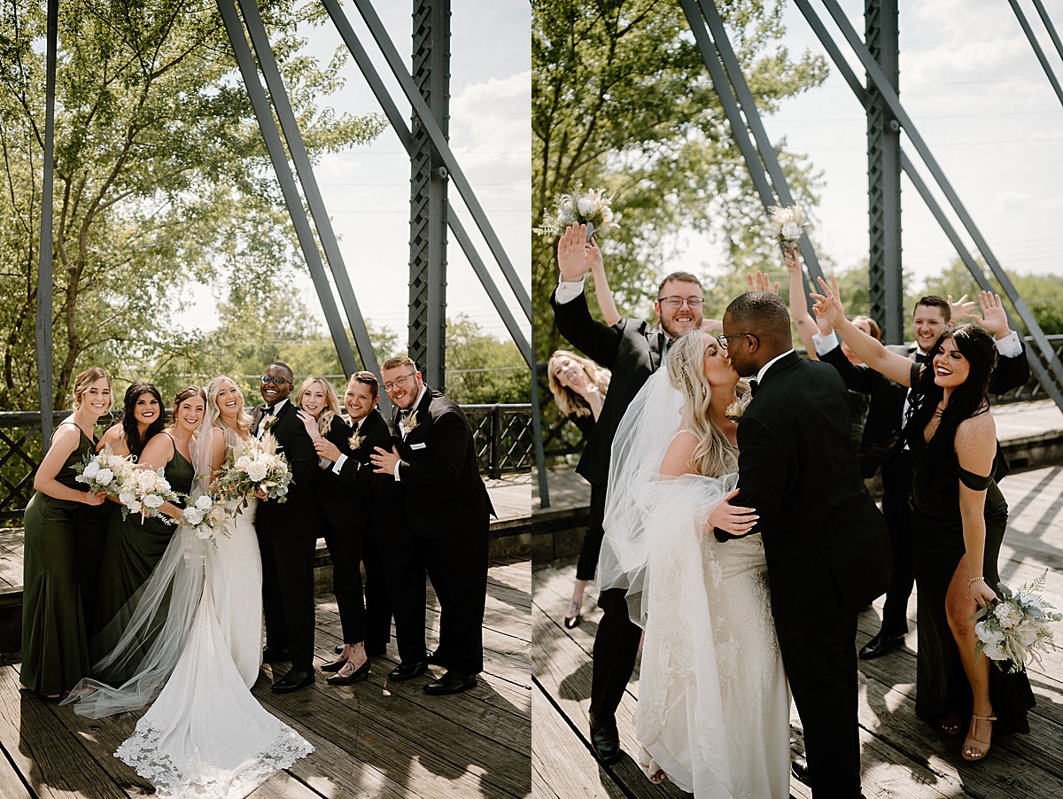 wedding party celebrates as bride and groom kiss on iron trestle bridge after ceremony shot by Indigo Lace Collective