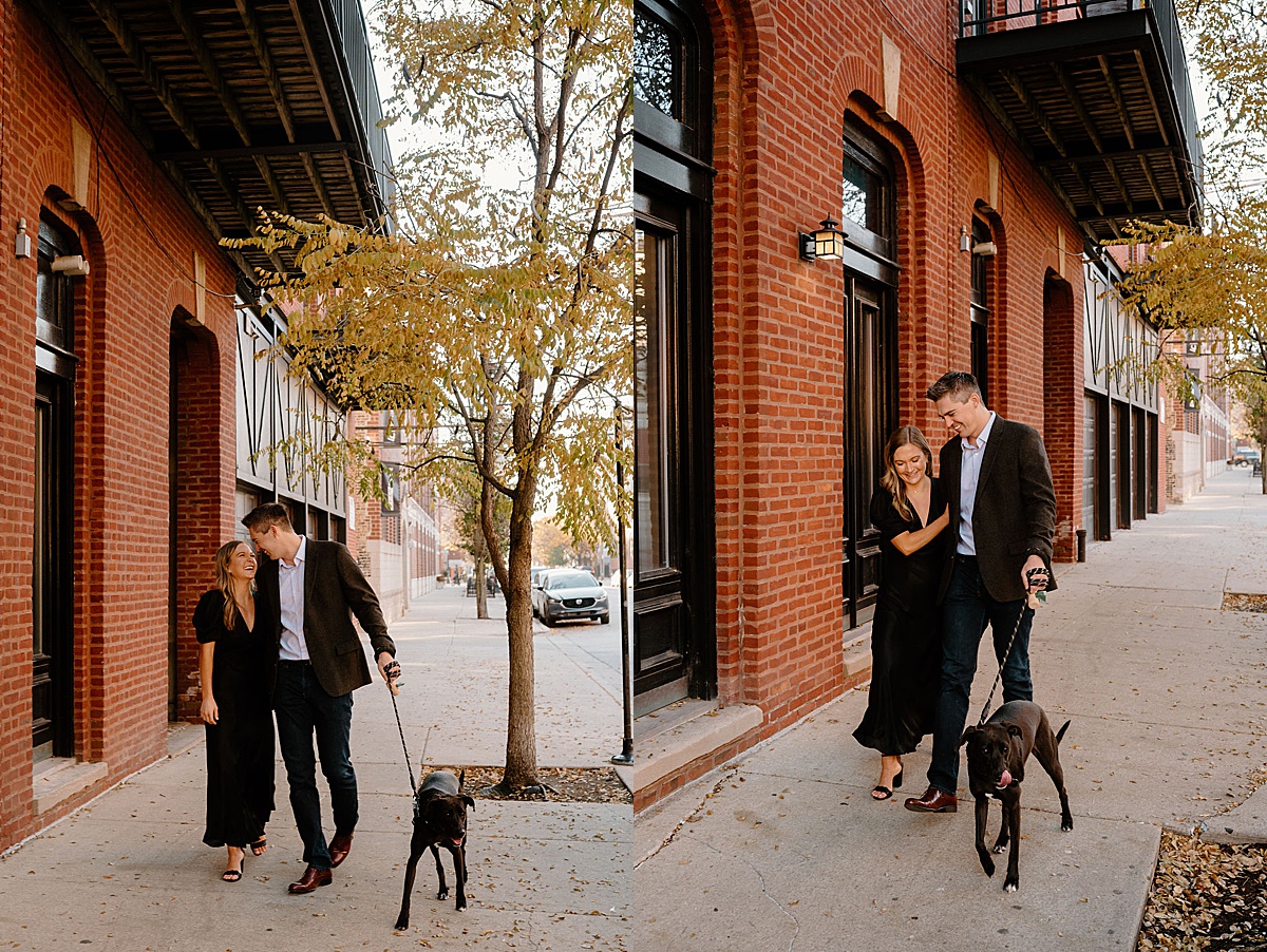 young professional couple stroll Chicago street with their dog during puppy love engagement session