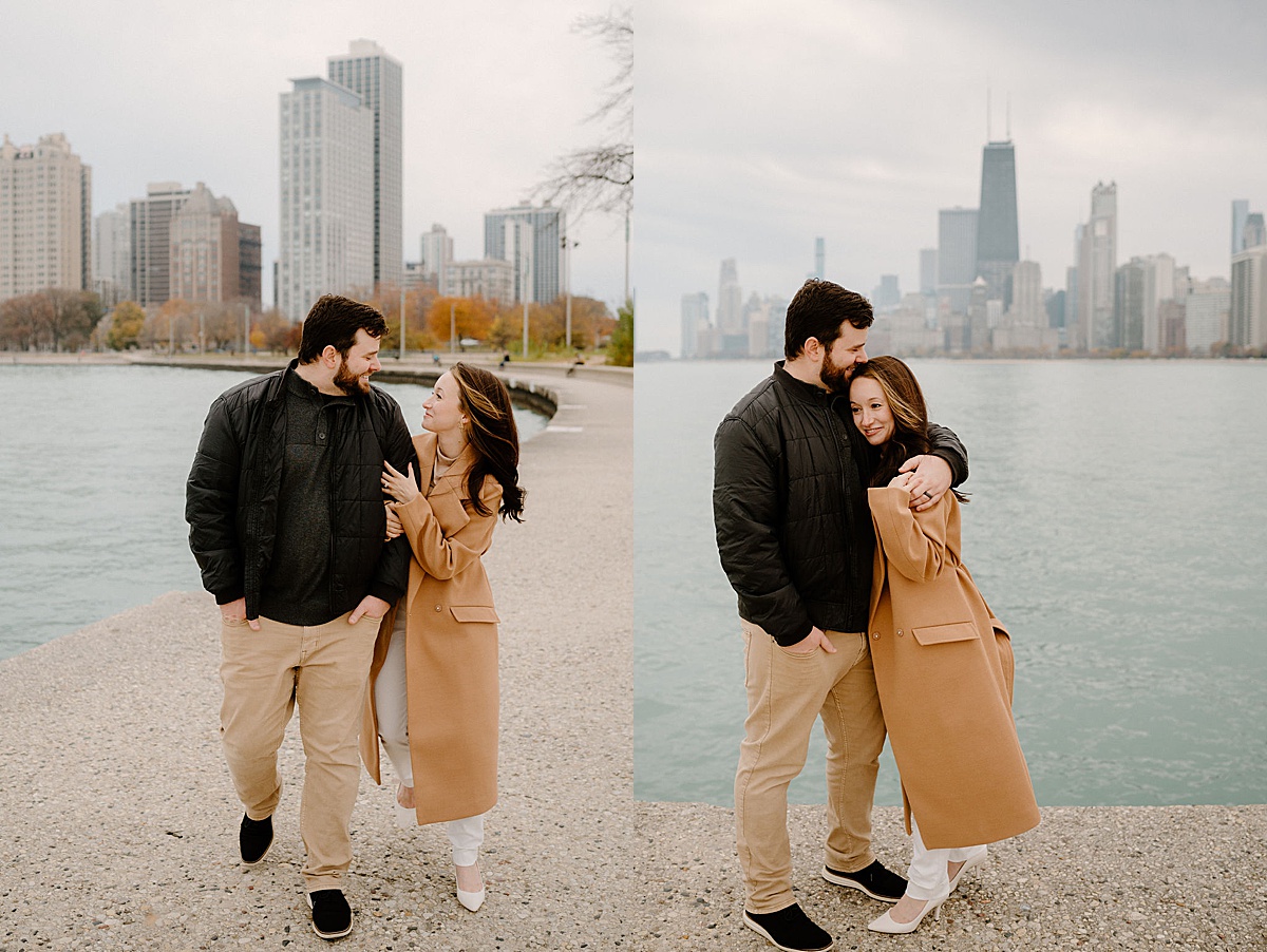 husband and wife pose in front of Chicago skyline during North Ave Beach Family Session