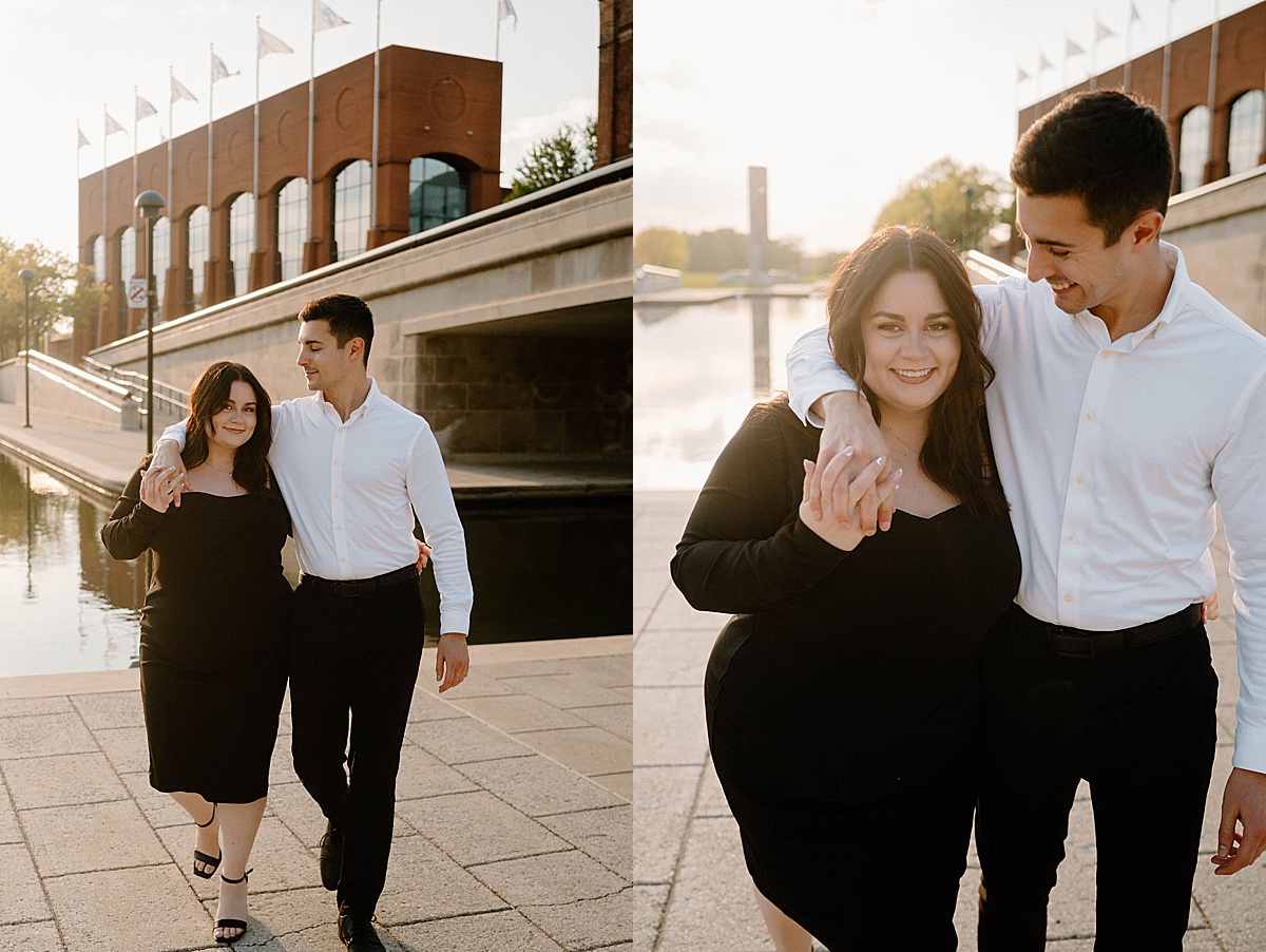 Couple pose at city waterfront during sweet Indianapolis sunset engagement shoot
