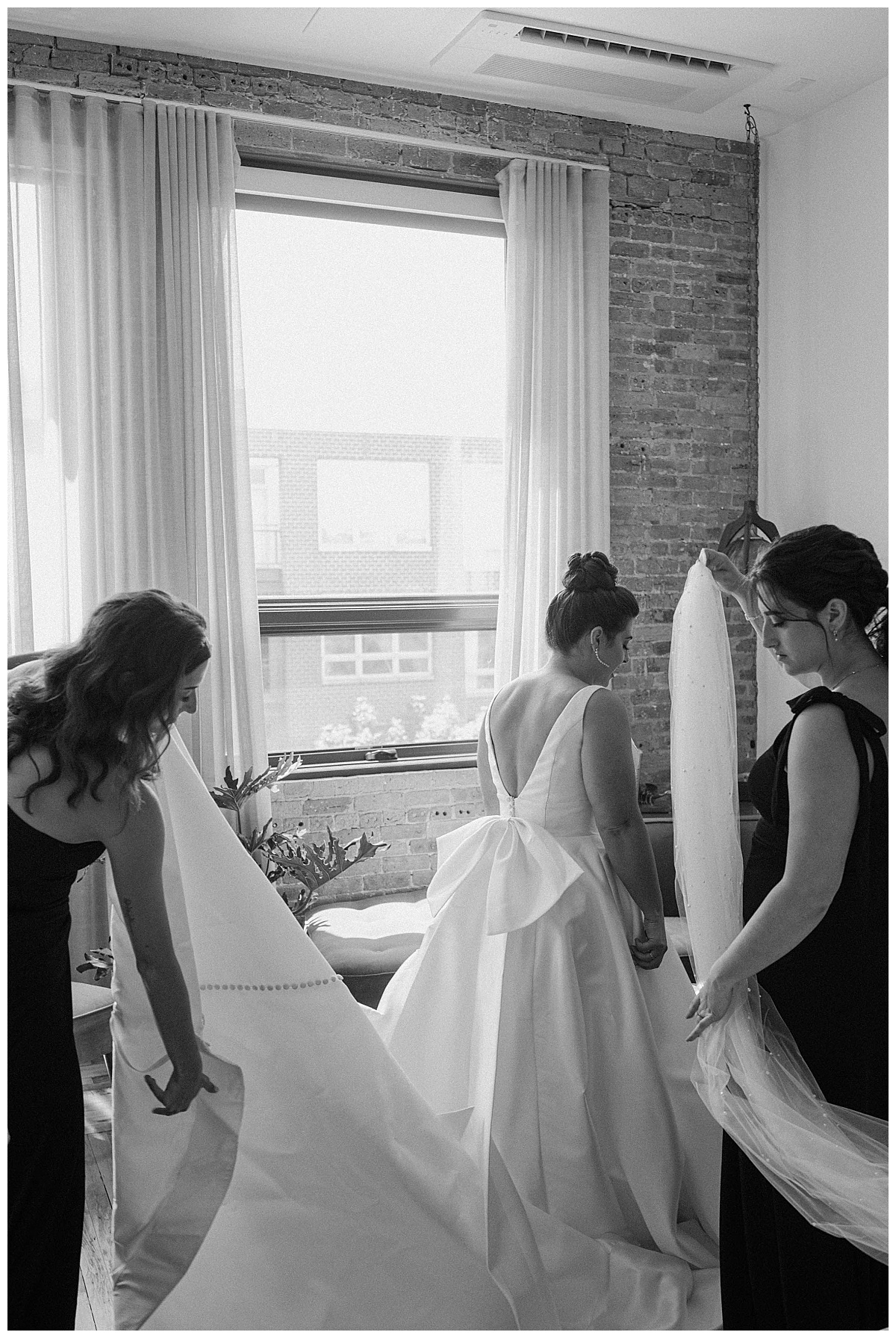 attendants prepare bride for Bridgeport Art Center wedding
