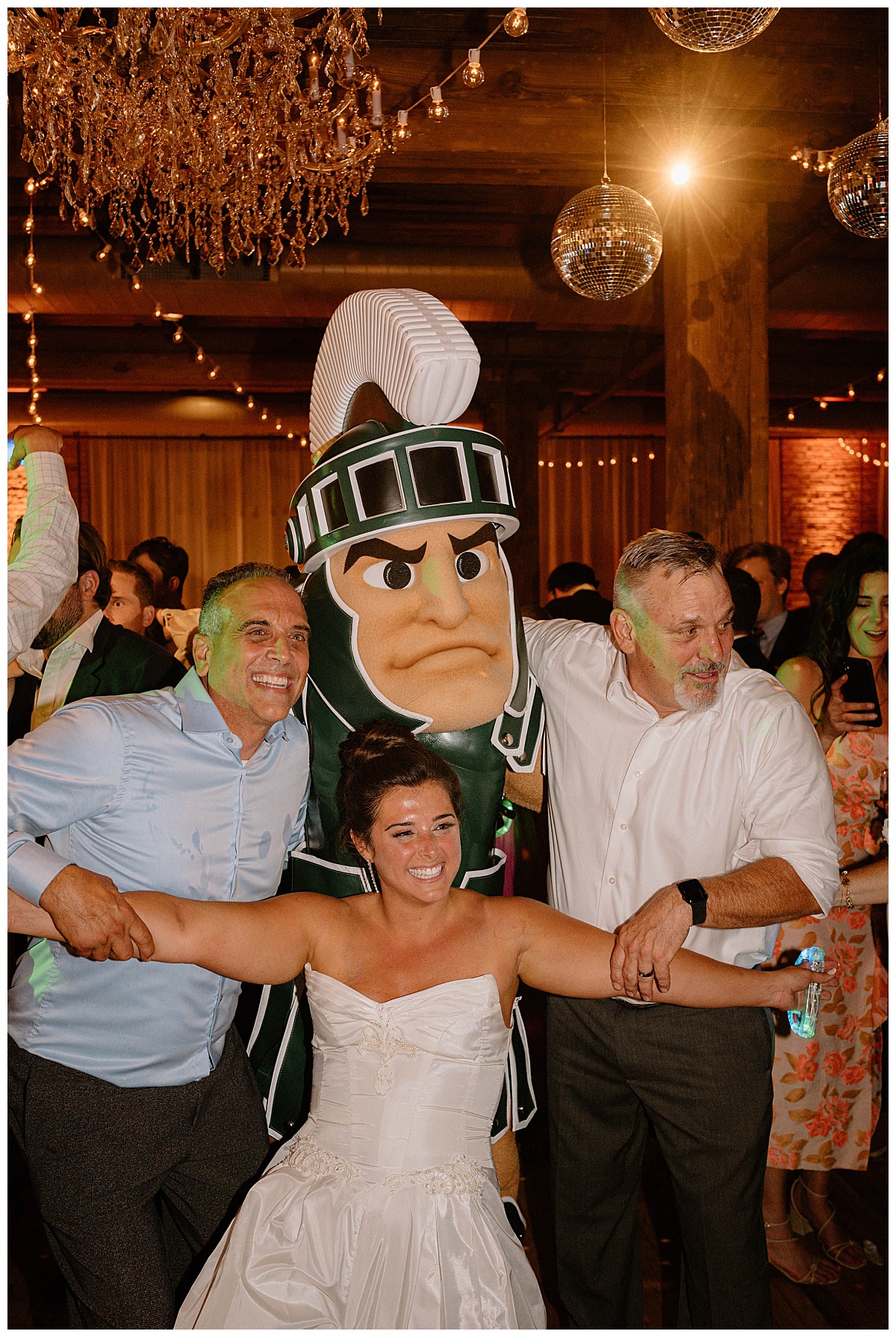 U of Michigan mascot Sparkie dances during reception at Bridgeport Art Center wedding