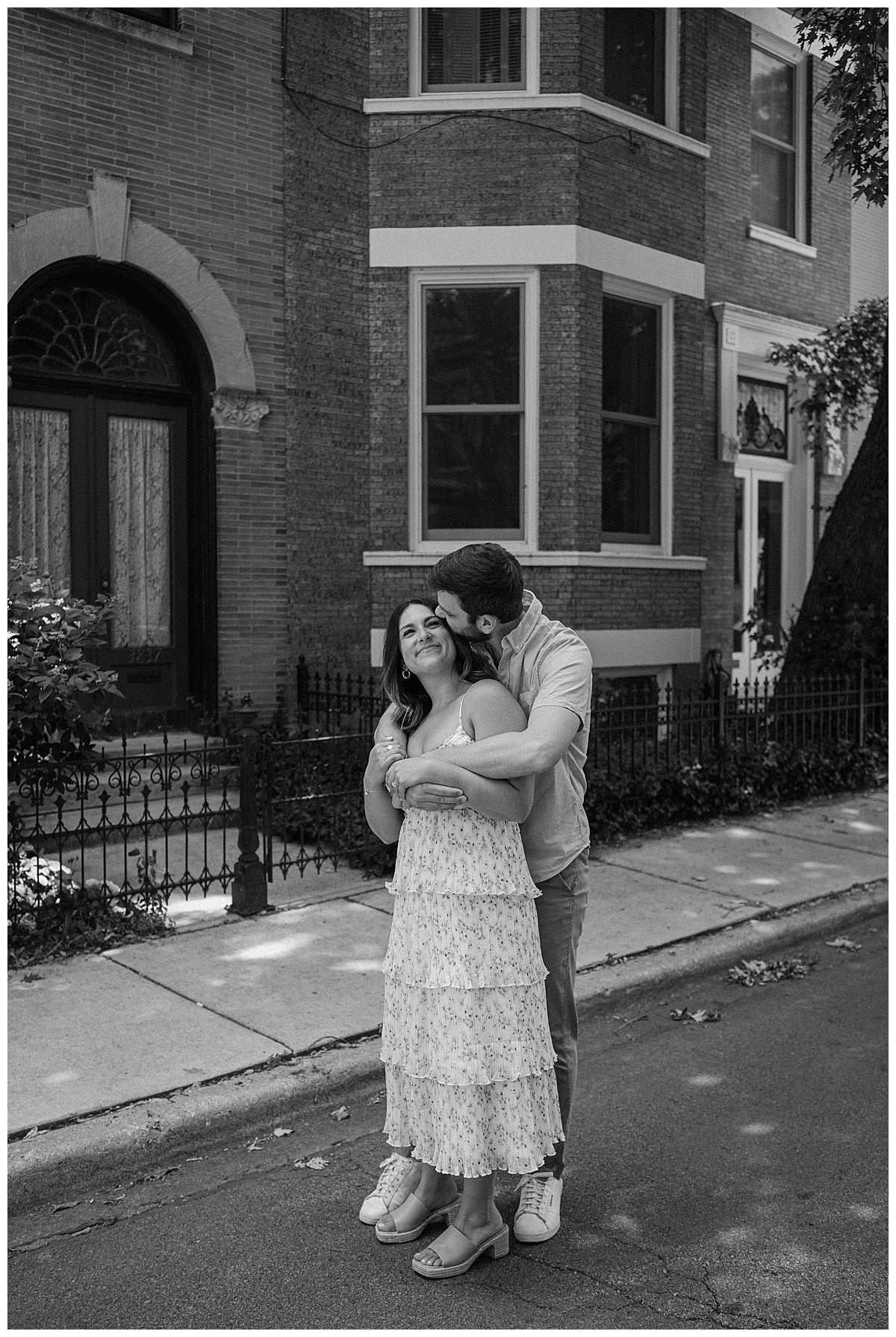 couple hugs in street by Chicago wedding photographer