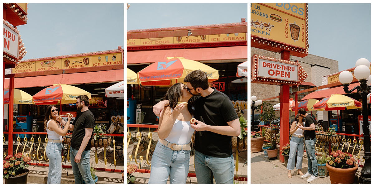 man and woman eat hotdog outside of brightly colored restaurant during Wrigley Field engagement session