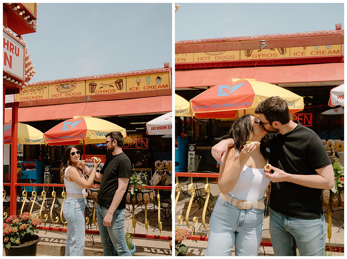 couple kisses after eating hot dogs by Chicago wedding photographer