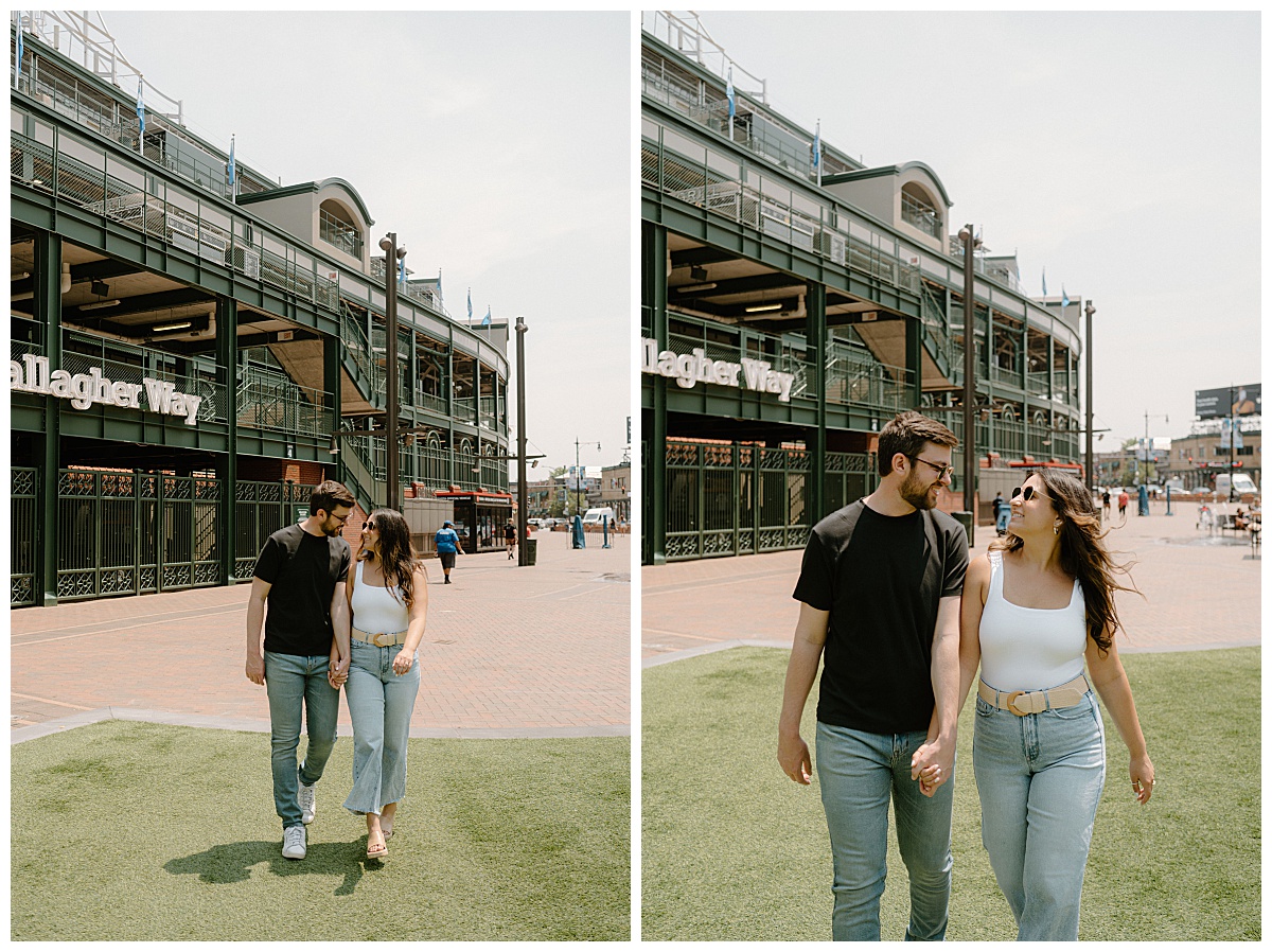 man and woman hold hands as they walk outside stadium during Wrigley Field engagement session