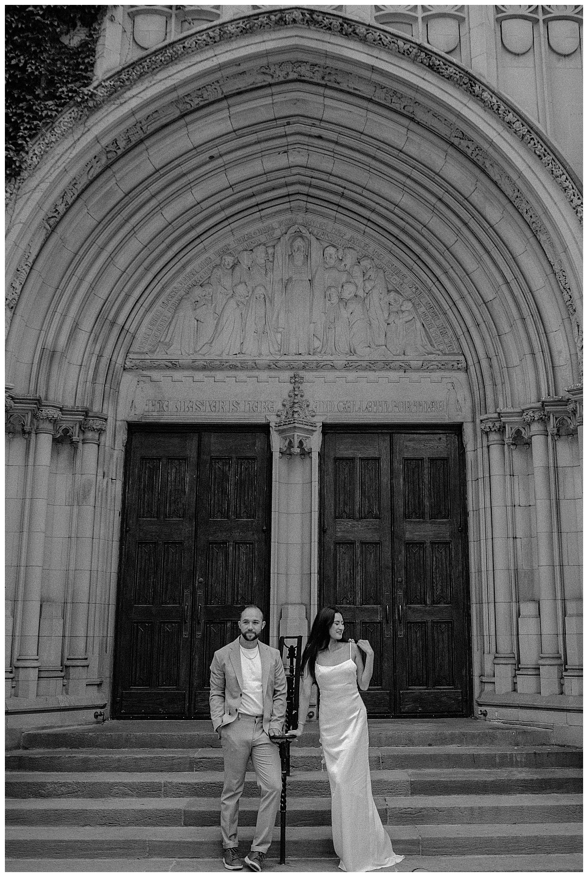 fiacnes stand on steps outside ornate budling by Chicago wedding photographer