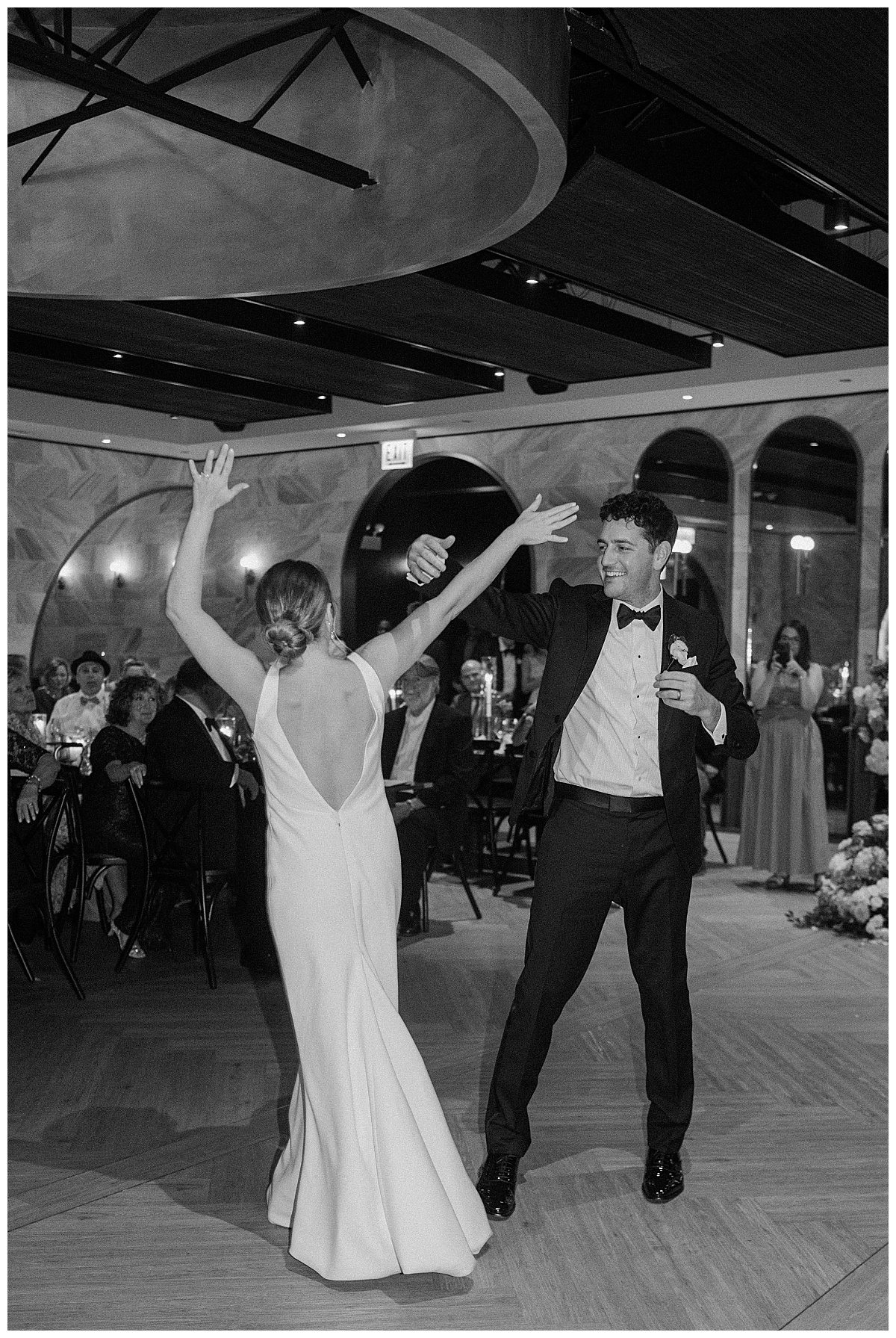 bride and groom dance together in front of guests at Chicago Winery