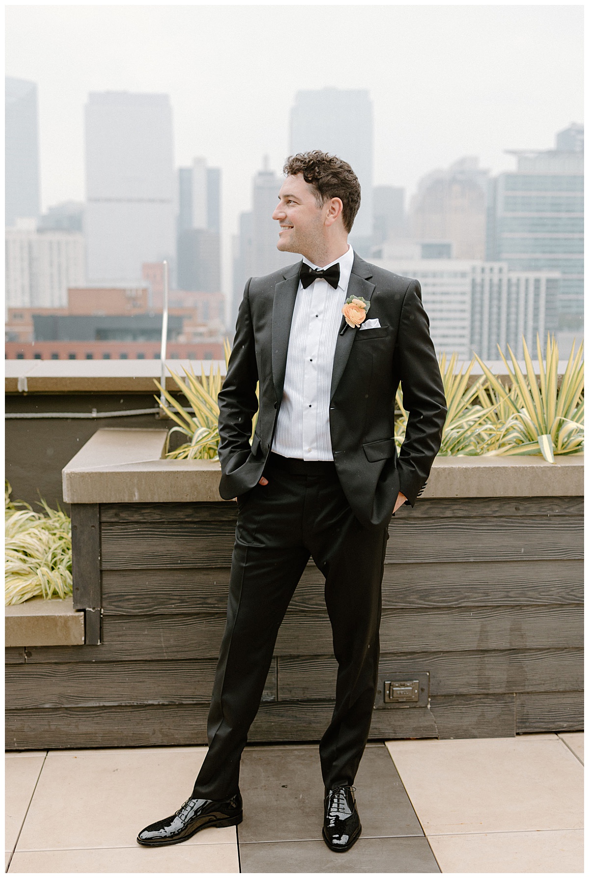 groom puts hands in pocket and looks to side by Indigo Lace Collective