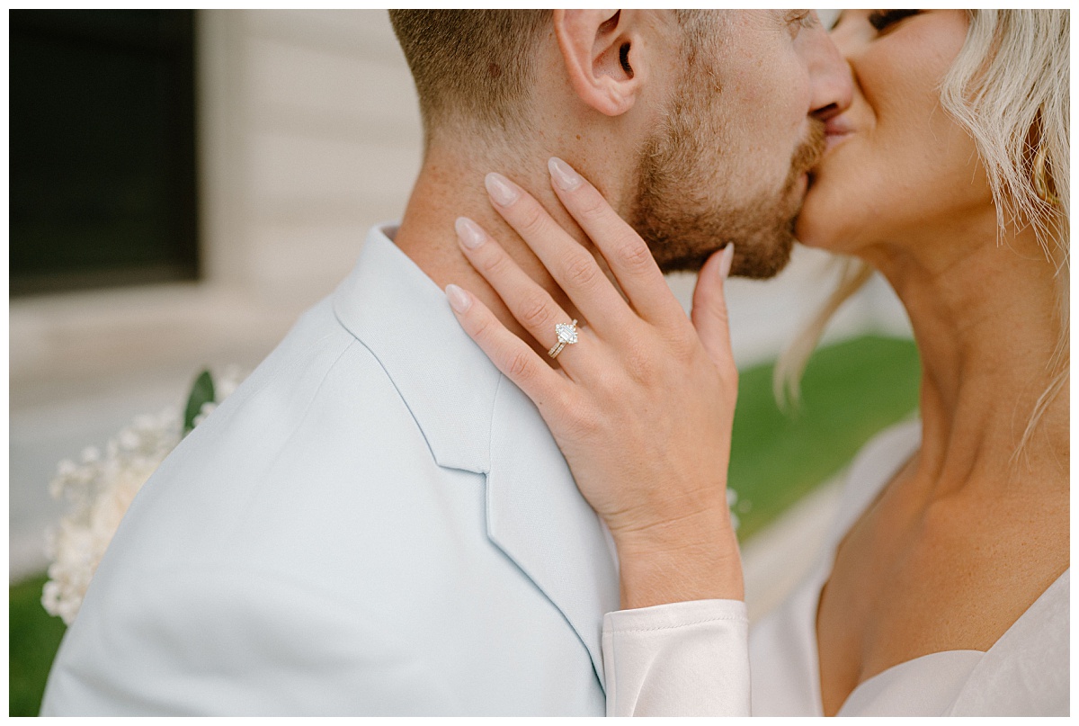 newlyweds kiss after their wedding by Indigo Lace Collective