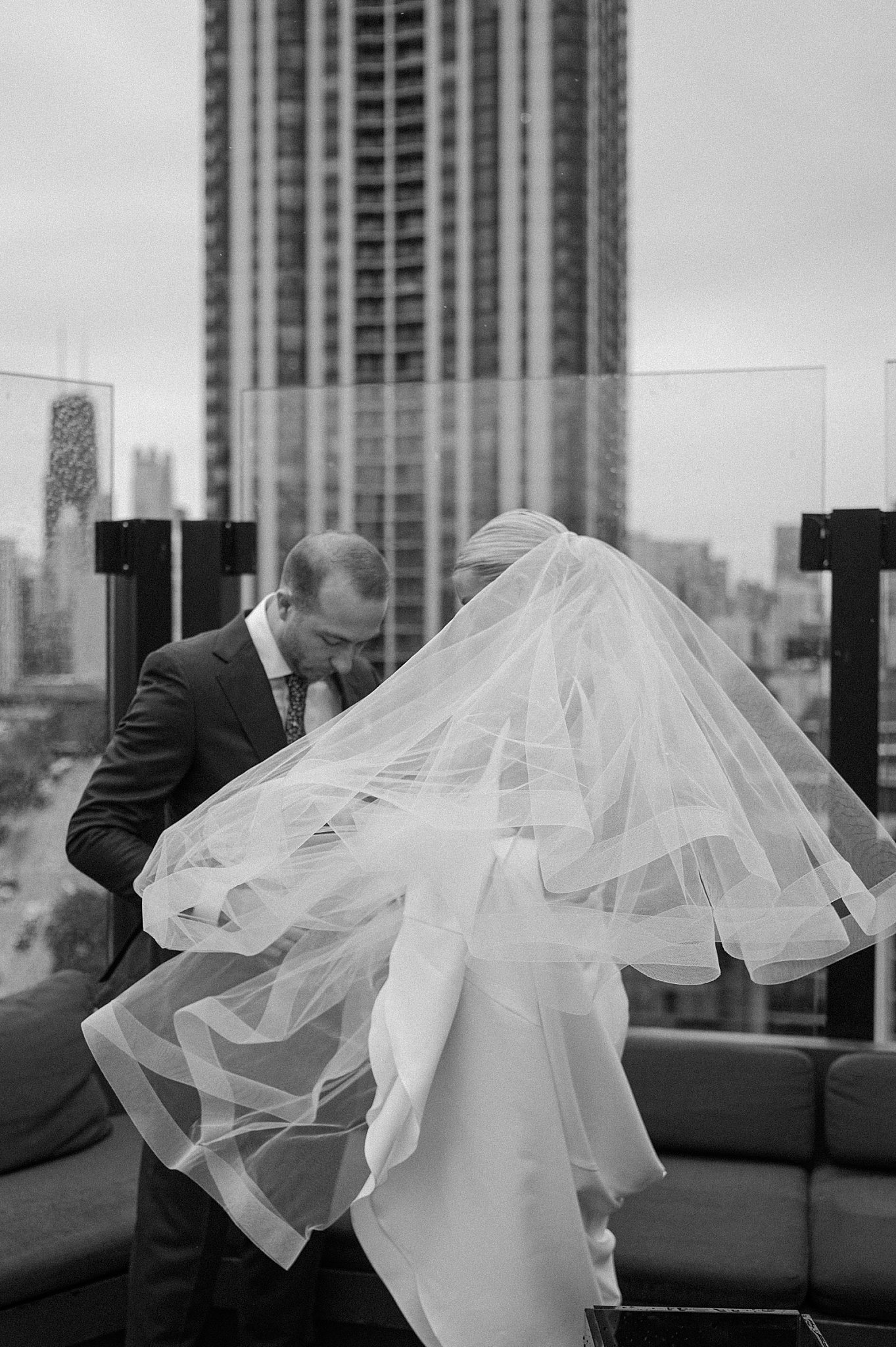couple shares first look on roof before Cafe Brauer reception