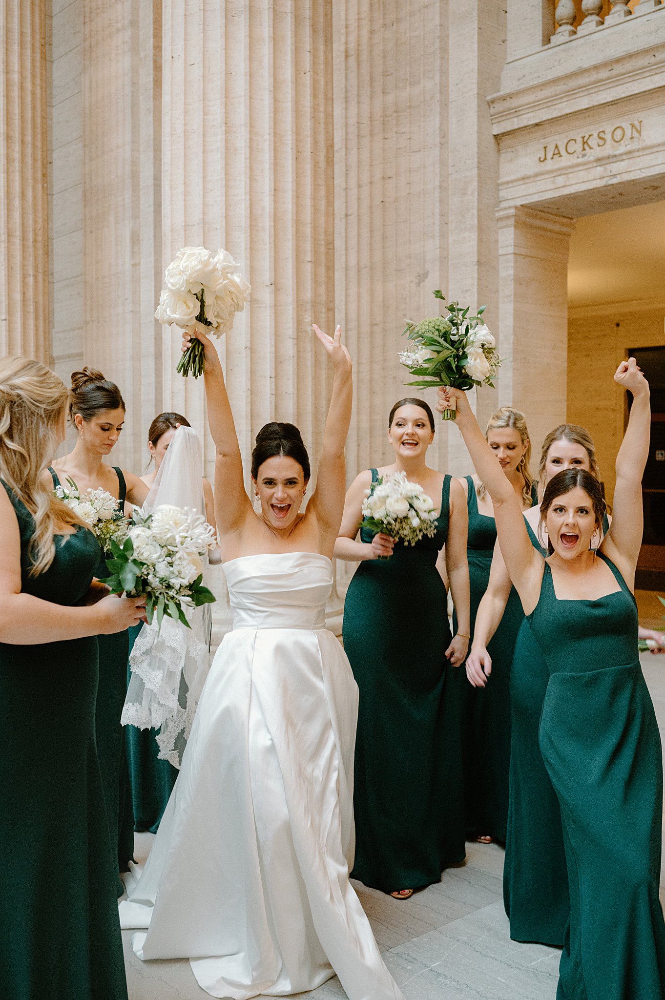 bridesmaids celebrate with bride by Midwest wedding photographer