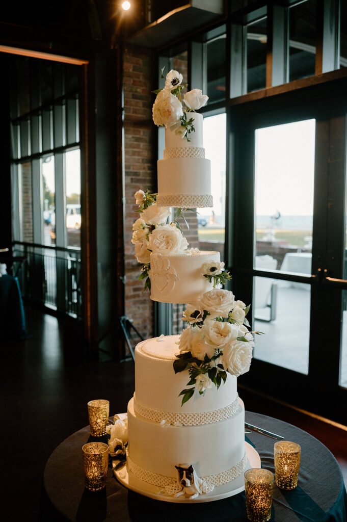 cake features florals and dog poking out of the bottom by Chicago Wedding Photographer