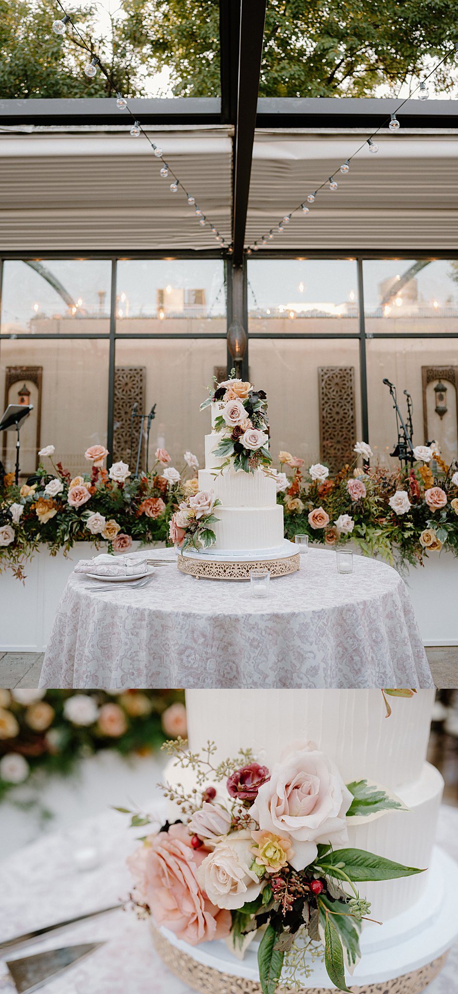 wedding cake adorned with florals sits on table by Indigo Lace Collective